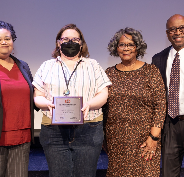 Image depicting 2024 award recipient for Special Programs. From left to right interim CDO, Lisa Fronckowiak, Dr.Setele , interim president Dr.Durand, interim VP of student affairs Dr. Brumfield