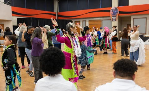 image of multicultural dancers in traditional outfits.